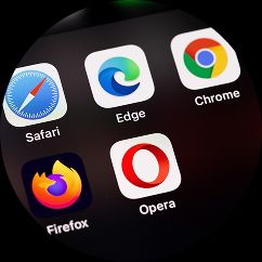 What is Cross-Browser Testing A close-up image of a phone with different web browser apps logos appearing.
