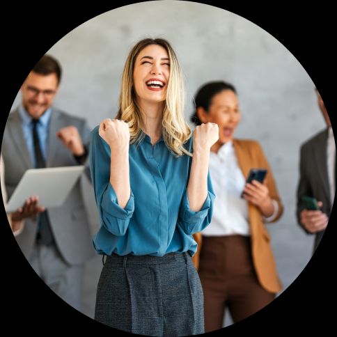 A group of professionals celebrating, focused on a blonde women
