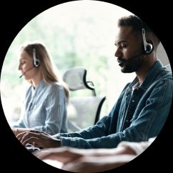 People sat at a desk with a headset on.